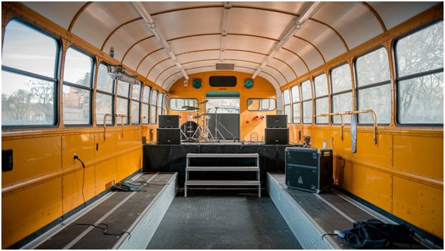 How do you convert a school bus into a stage